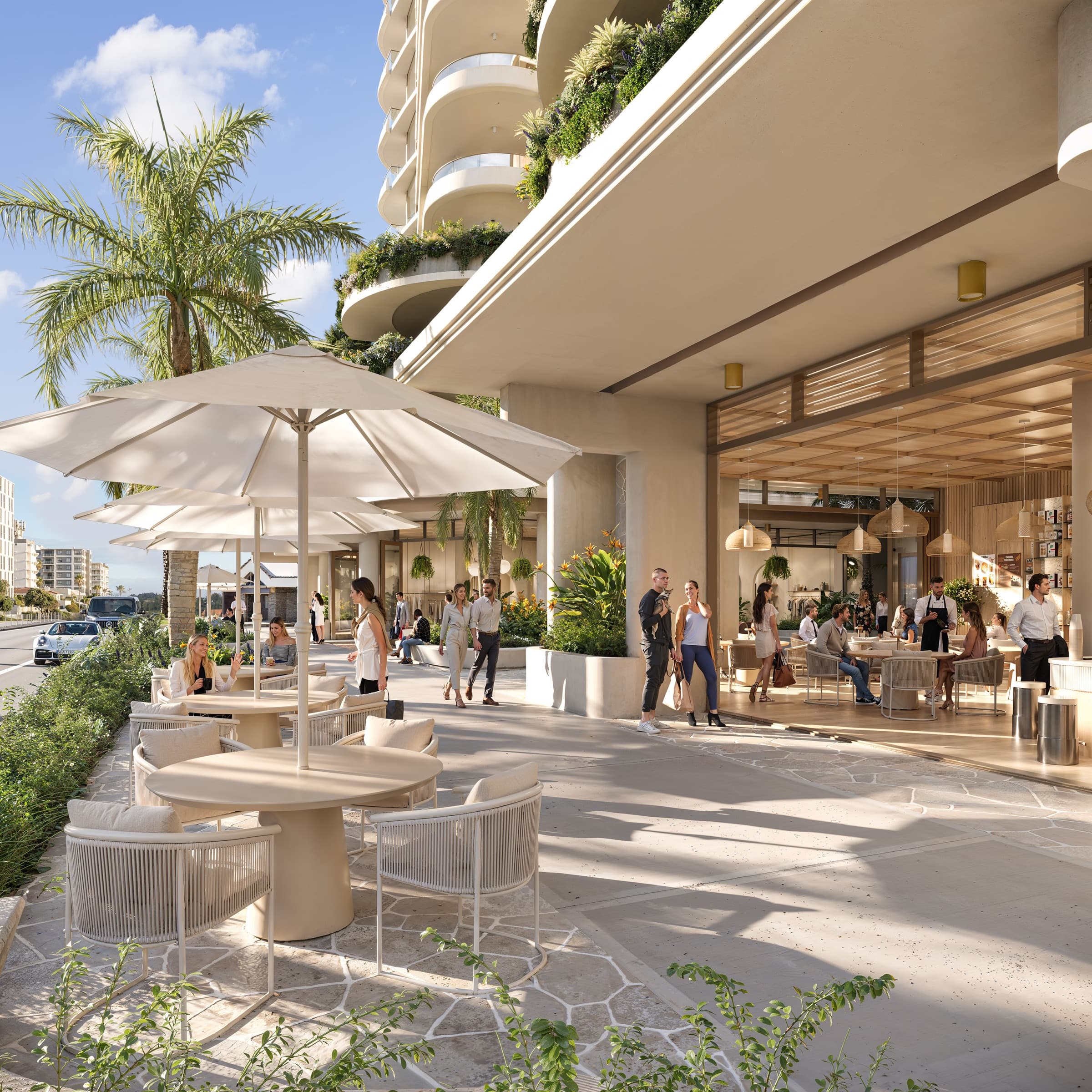 Soleira ground-floor retail at street level, with outdoor cafe seating beneath the tower